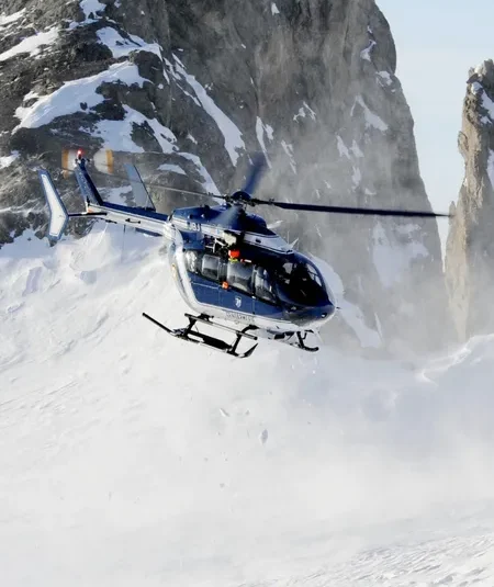 Helicopter flying in mountains