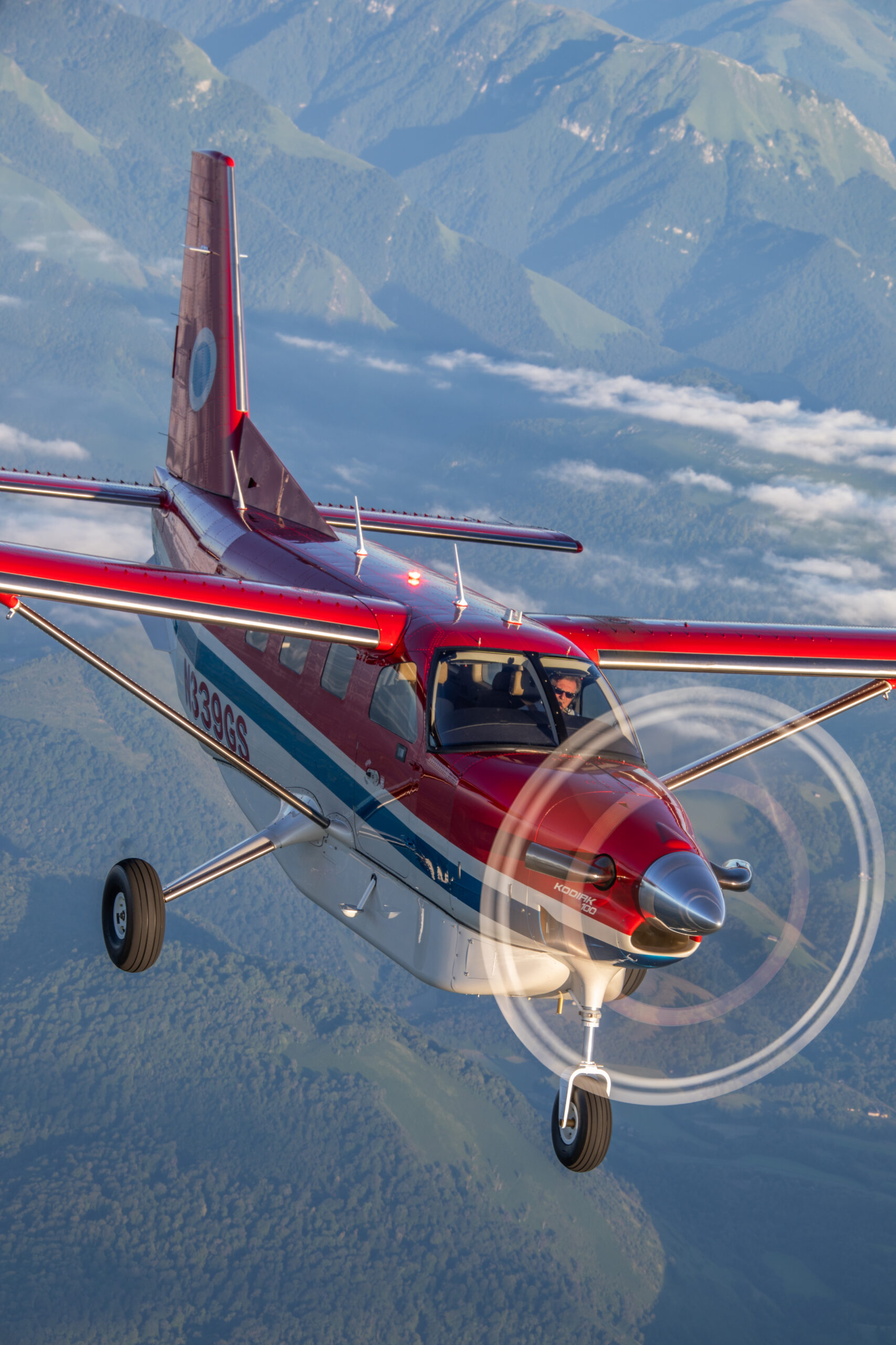 Daher Kodiak100 airborne over the mountains