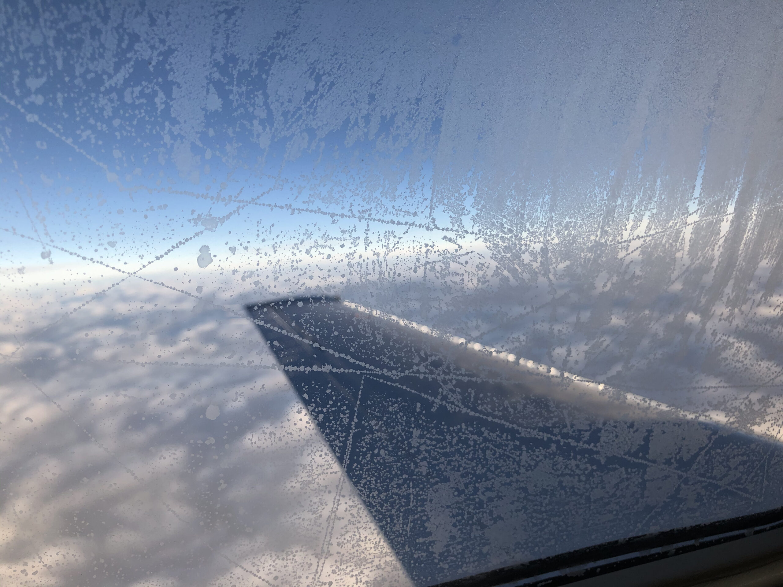 Iced up airplane passenger window