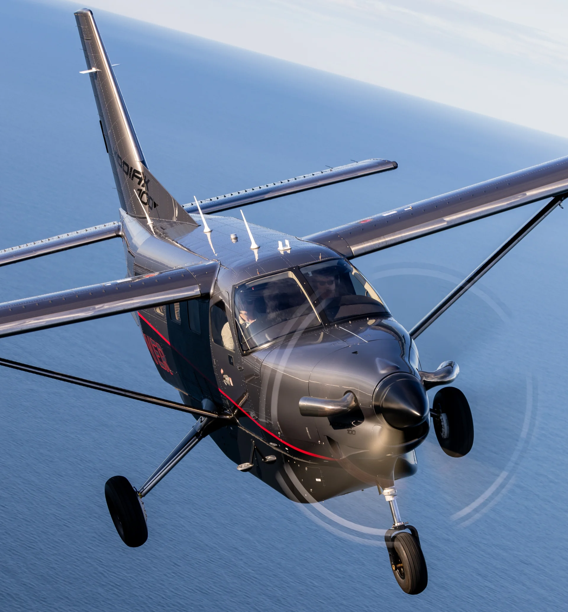 Daher Kodiak 100 in flight over the blue ocean