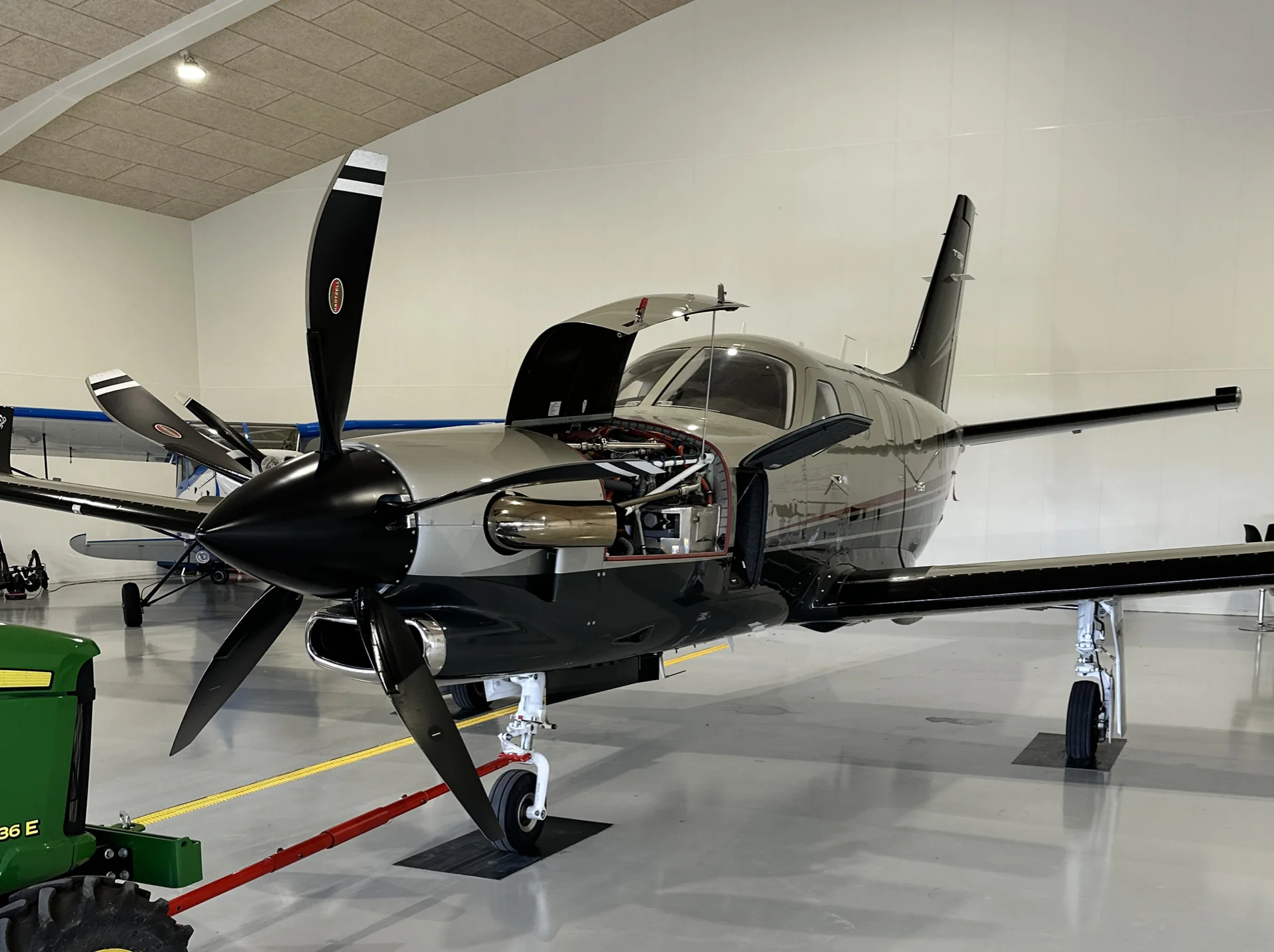 A TBM 940 parked in a hangar. 