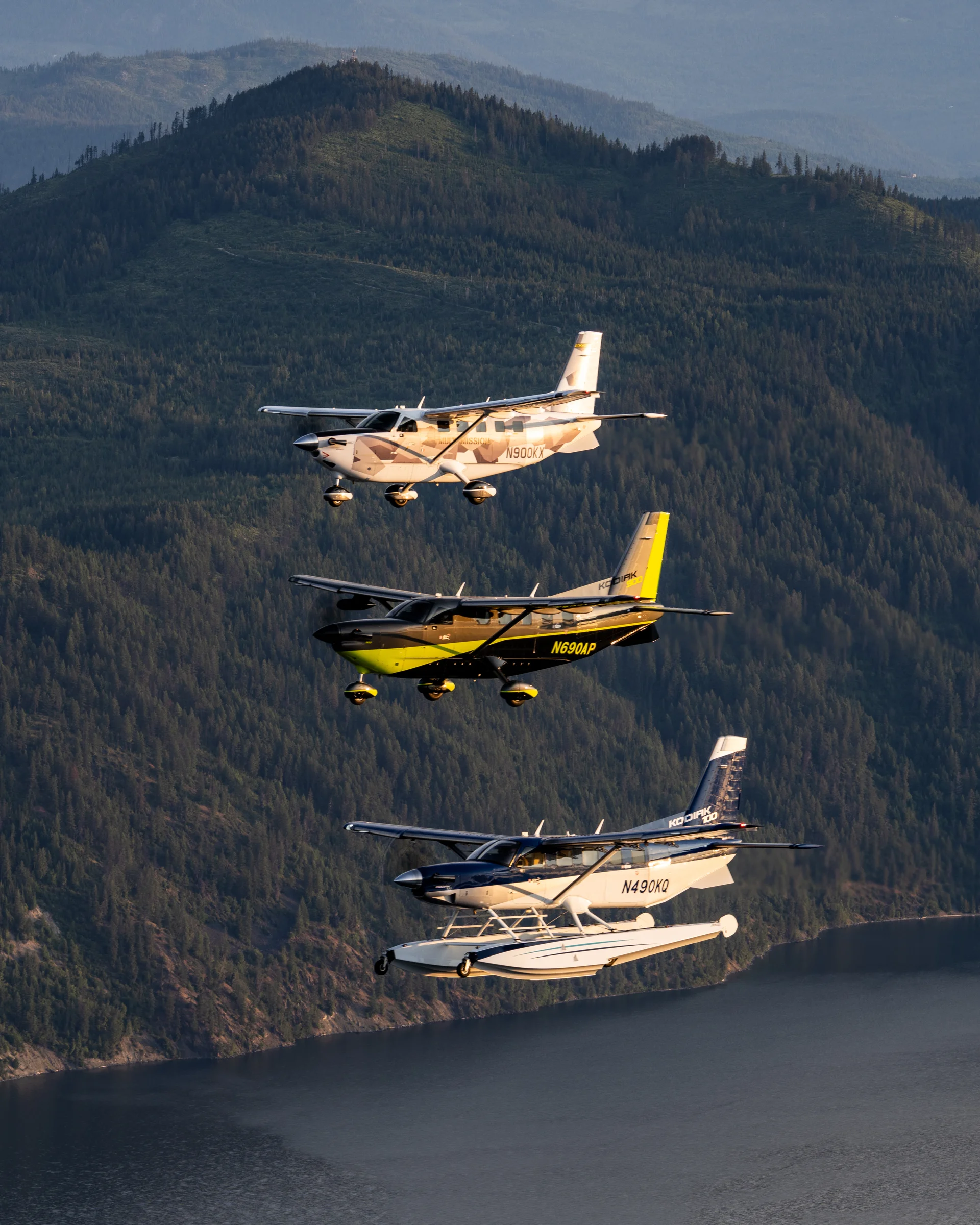 Three Daher Kodiaks flying in display formation. Two Kodiak 900 and one Kodiak 100 with floats option.