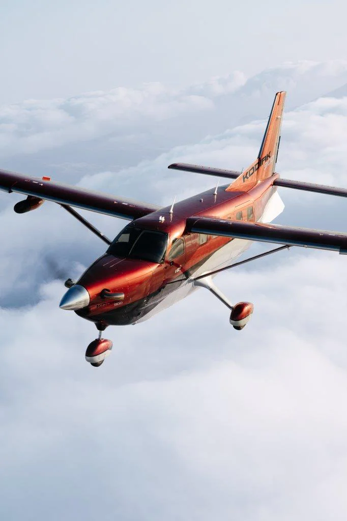 Kodiak 900 in flight over the clouds
